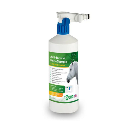 White plastic bottle with blue spray nozzle and green label of aqueos anti-bacterial horse shampoo water based disinfectant