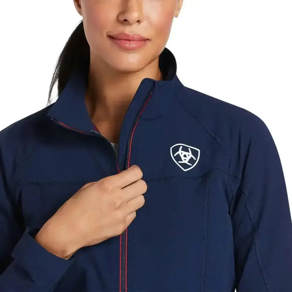 Navy blue ariat agile softshell jacket for women with white logo and red zipper trim perfect for outdoor use