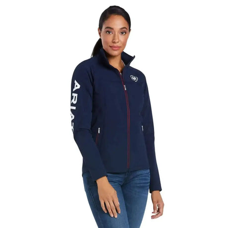 Navy blue ariat agile softshell jacket with soft shell material white vertical lettering on the sleeve and chest logo