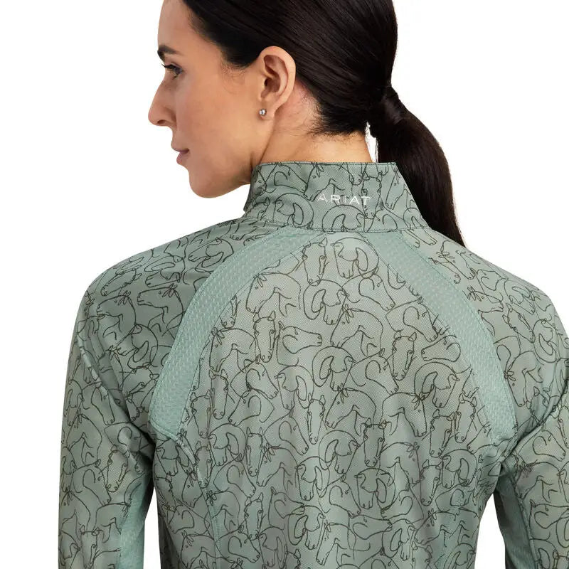 Light green long-sleeve ariat sunstoppers base layer with heat series technology and moisture movement fabric for riding