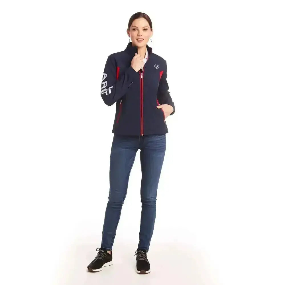 Navy blue and red ariat womans team softshell jacket with zip-up front and fierce colourblock styling with white sleeve lettering