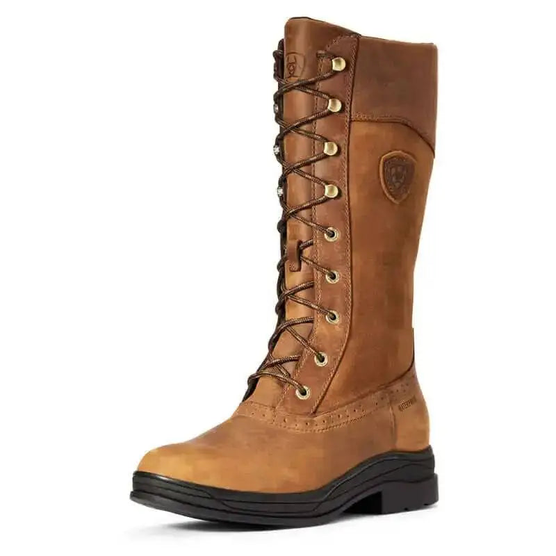 Tan leather lace-up ariat wythburn waterproof boot with gold eyelets and black rubber sole for fashion-forward country styling