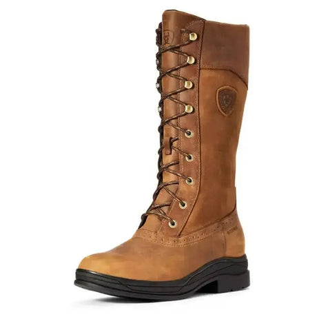 Tan leather lace-up ariat wythburn waterproof boot with gold eyelets and black rubber sole for fashion-forward country styling