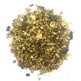 A pile of crushed gold flakes and dark mineral fragments from badminton country mix all-round smallholder ration feed