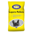 Bright yellow bag of badminton layers pellets 20 kg with black and white chicken image for poultry feed