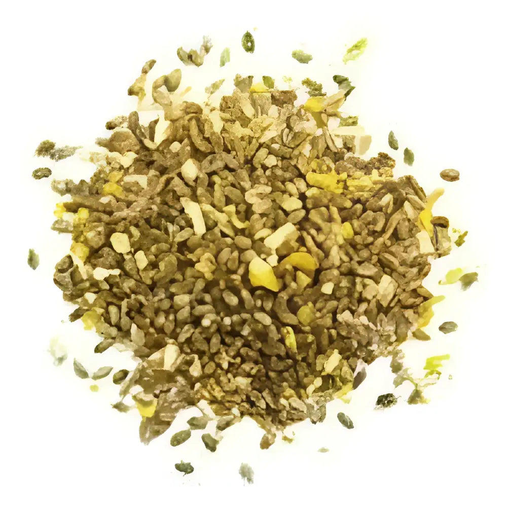 A pile of mixed green and yellow seeds showing an appetising blend of mixed poultry corn for a fully balanced ration