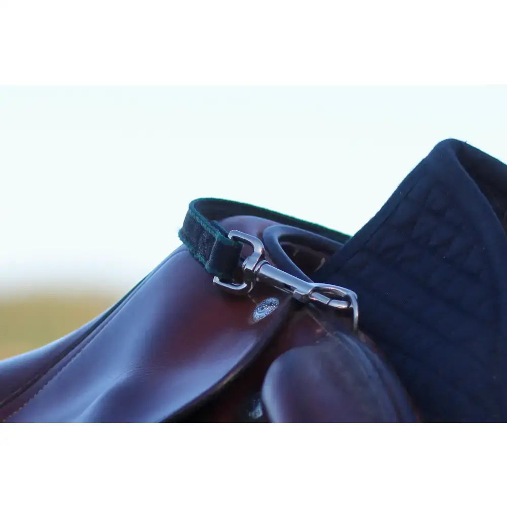Dark brown leather balance handle with green webbing strap and silver trigger clips featuring a rubber grip