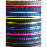 A stack of banbury headcollar straps in bright colors made of 16mm soft webbing with metal fittings for minis alpacas and llamas