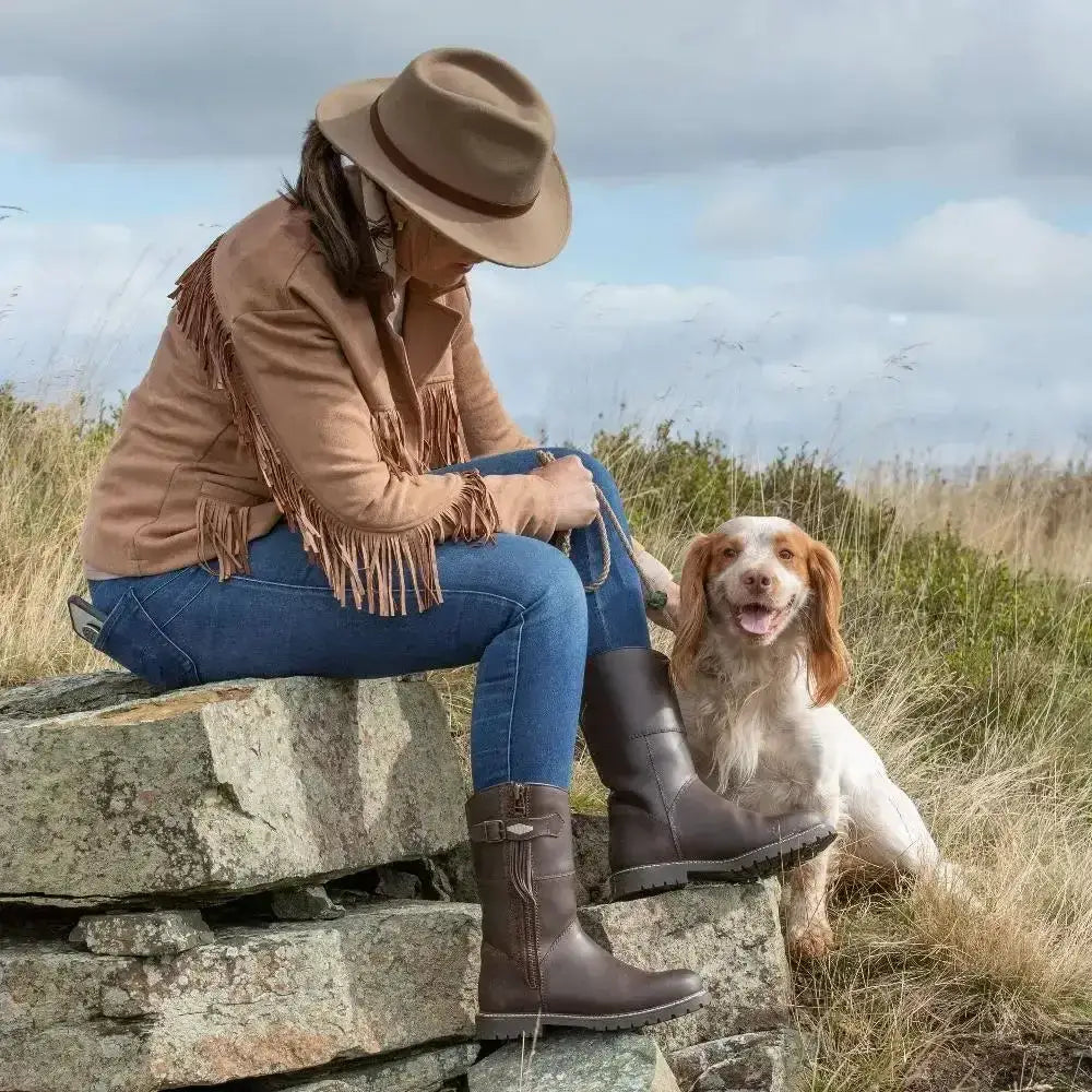 Brown leather hudson mid boots with side zipper, metal buckle, wil-tex membrane, and cozy sheep wool insole