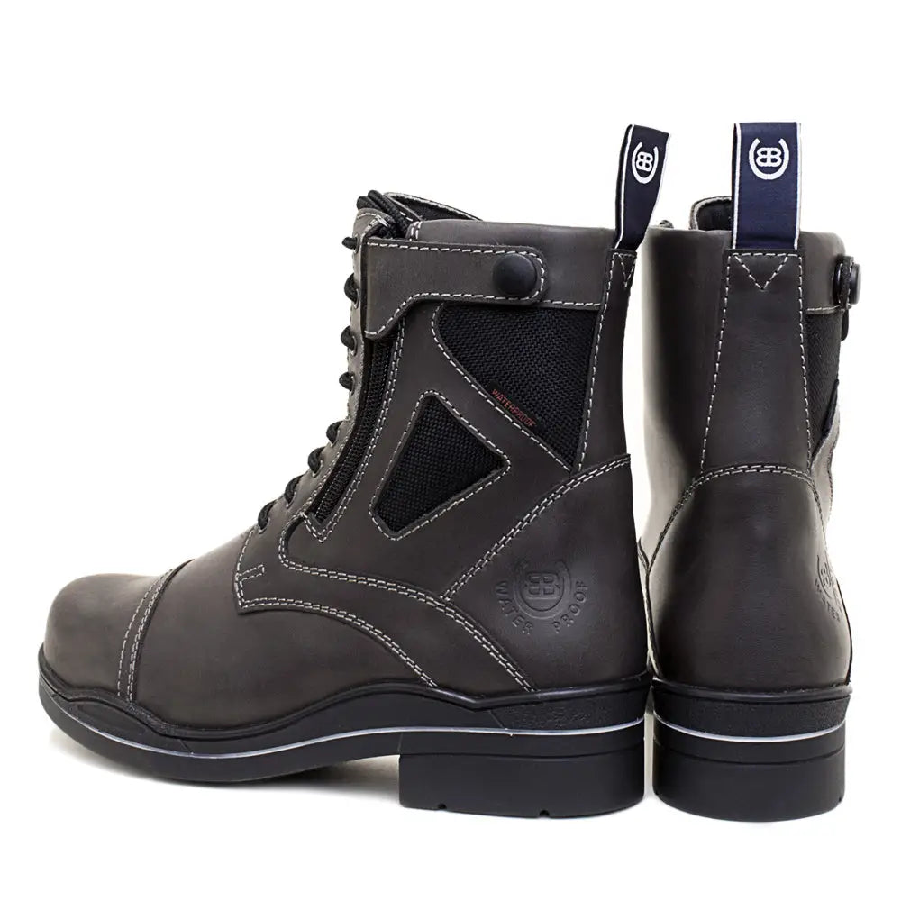 Dark gray leather bareback footwear kentucky storm waterproof ankle boots with black mesh panels and white stitching back view