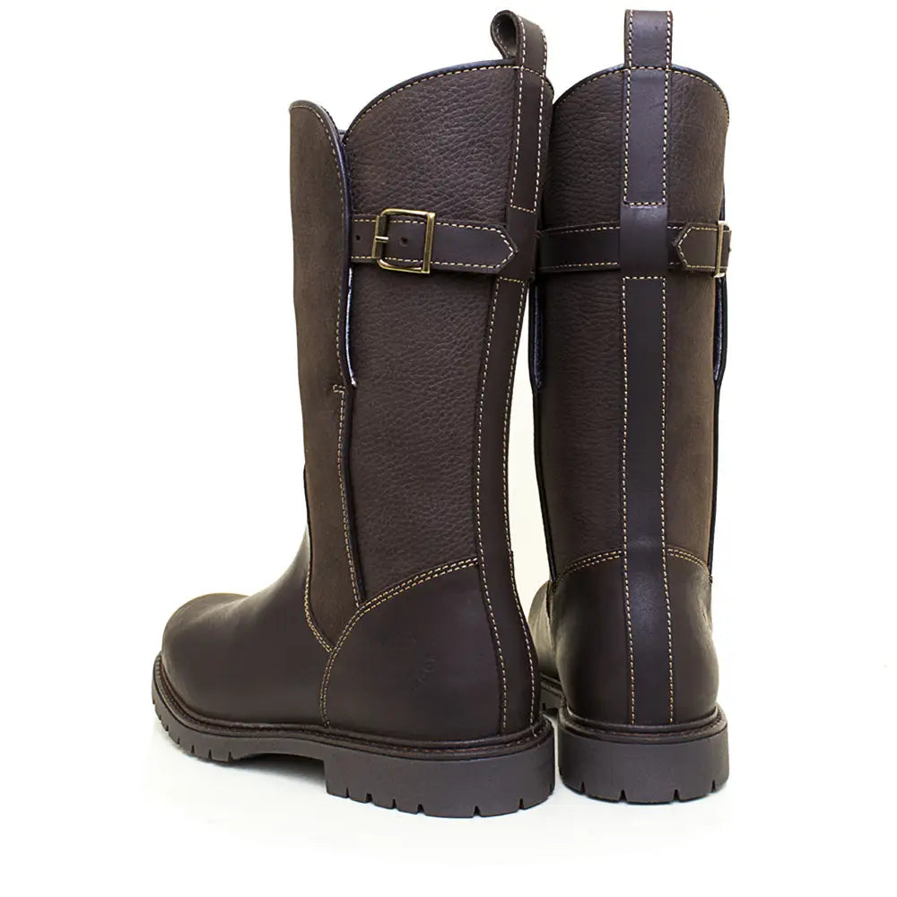 Dark brown bareback footwear quebec waterproof boots with textured leather, adjustable straps, and brass buckles
