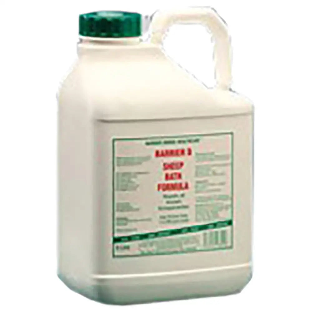 White plastic jug with green cap and handle labeled barrier 3 sheep bath formula by barrier animal health for sheep dip organic farming