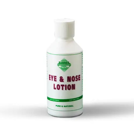 White plastic bottle of africana barrier anti-bacterial eye and nose lotion with green and red labeling for gentle formulation to remove discharge