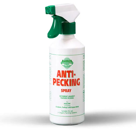 White plastic spray bottle with green trigger labeled barrier anti pecking spray to deter feather pecking in poultry