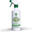 White plastic spray bottle with green cap labeled barrier grass and stable stain remover removes heavy soiling