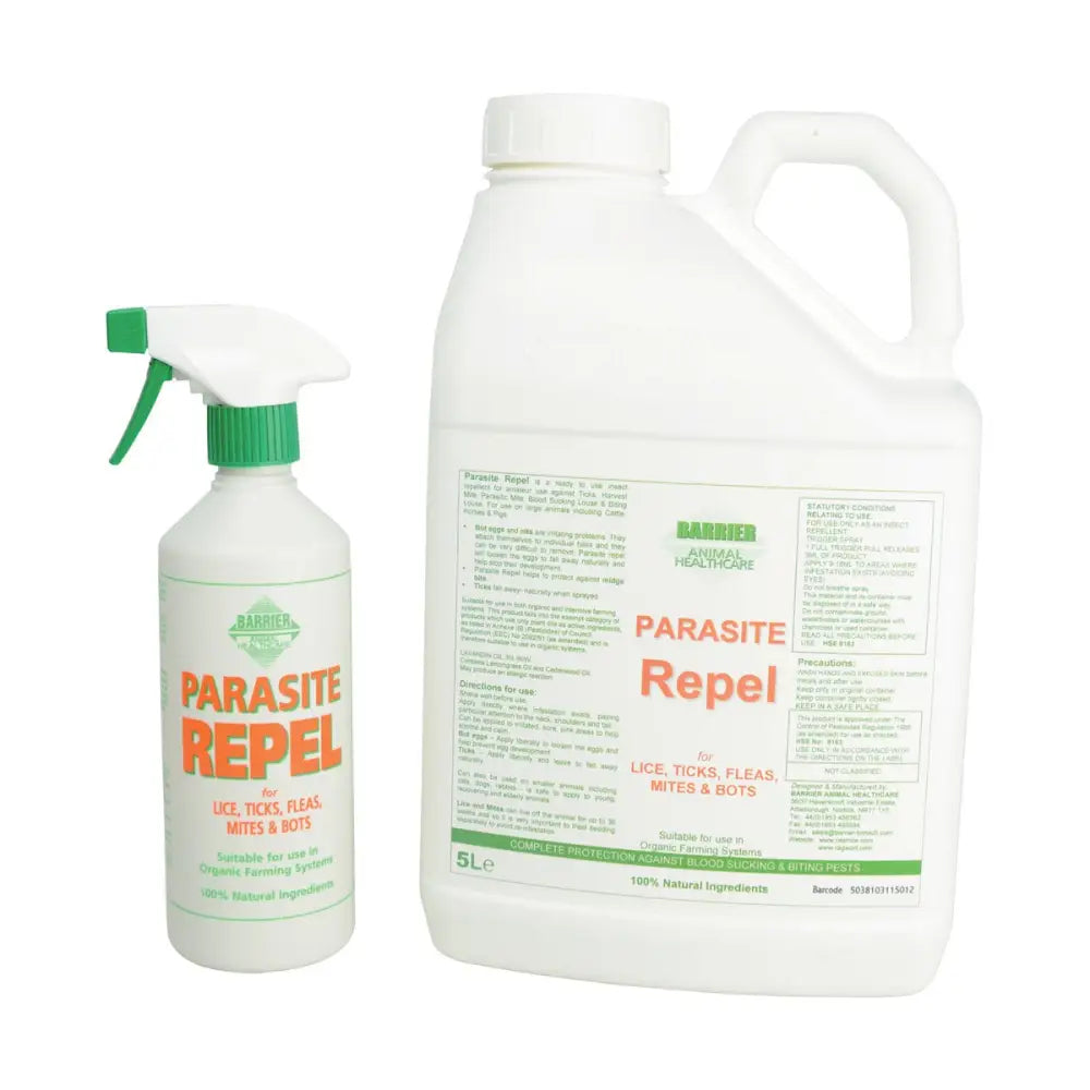 White plastic spray bottle with green trigger labeled barrier parasite repel for lice sprays in pet supplies