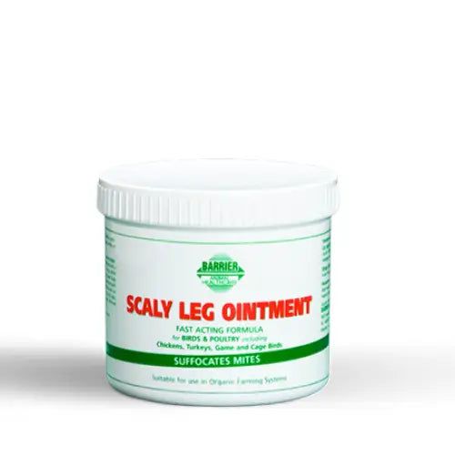 White plastic container of barrier scaly leg ointment with green and red label for treating scaly leg mite in birds
