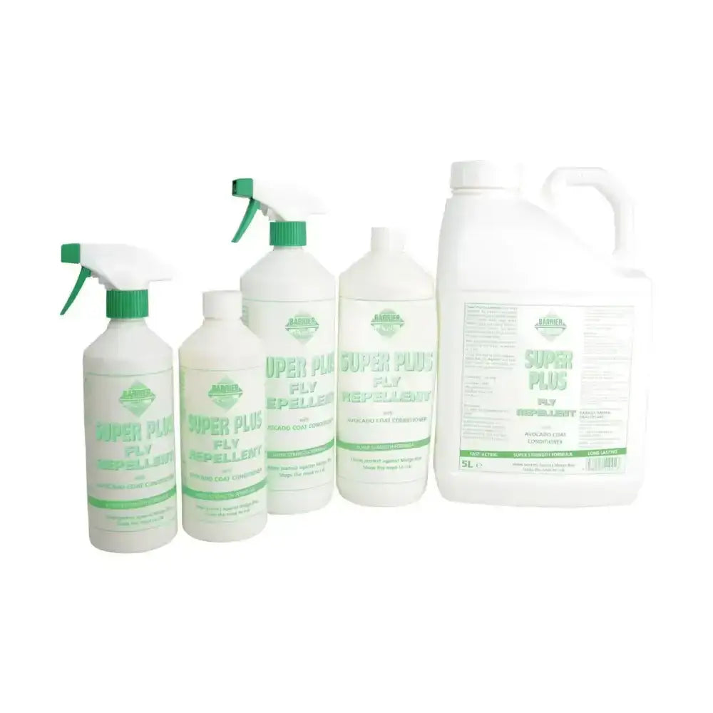 White plastic spray bottles and jug with green caps of jardine barrier super plus fly repellent spray for awkward areas natural formulation