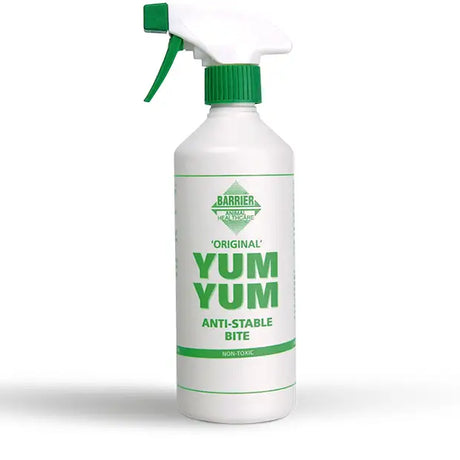 White plastic spray bottle with green trigger labeled barrier yum yum foul tasting spray to stop chewing instantly