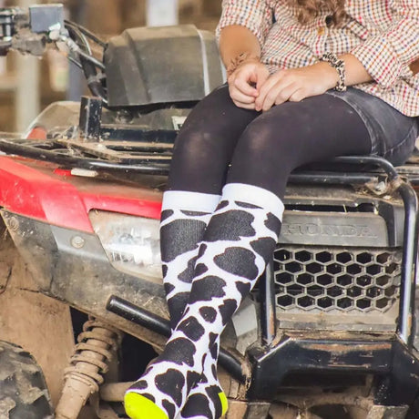Black and white cow print funky welly socks ladies cow patch with neon green toe for a fun bold look