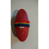 Red oval-shaped basic body brush with a rainbow-colored woven strap for grooming horses and basic body care