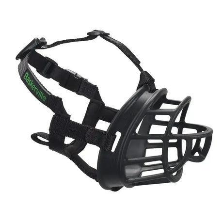 Black plastic and fabric baskerville ultra dog muzzle with green branding strap offers maximum safety for dogs