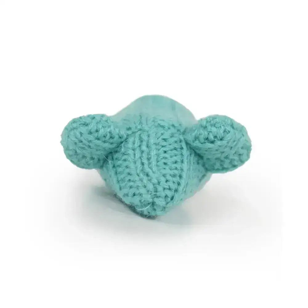 A soft teal crocheted bear toy from battersea tune chaser mice with motion activated sounds and textured knit pattern