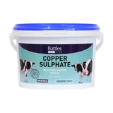 White plastic bucket with blue lid and handle labeled battles copper sulphate for animal husbandry hoof care