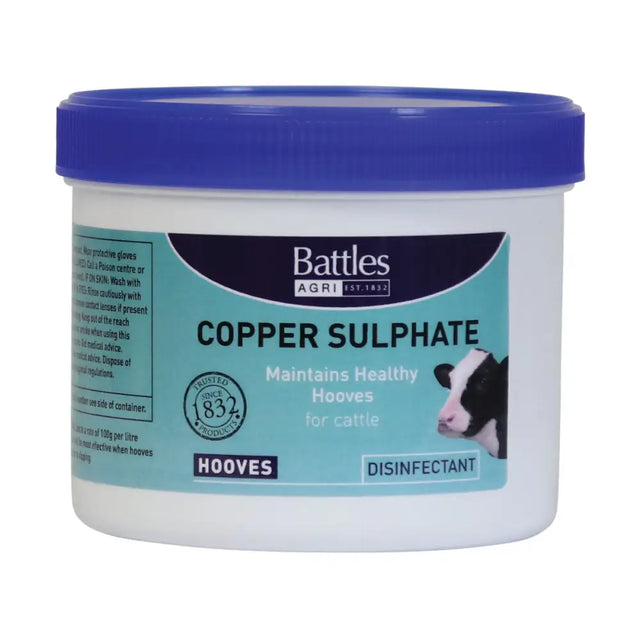 White plastic container with blue lid and teal label of battles copper sulphate hoof disinfectant for animal husbandry
