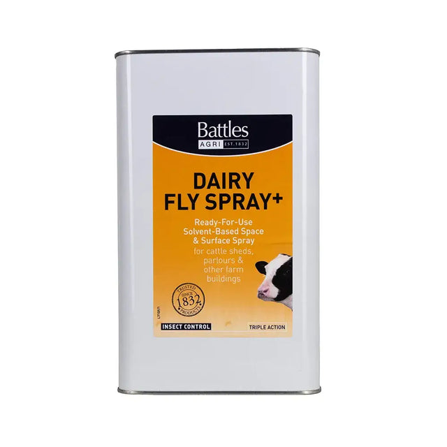 White metal can of battles dairy fly spray with orange and black label featuring a cow illustration