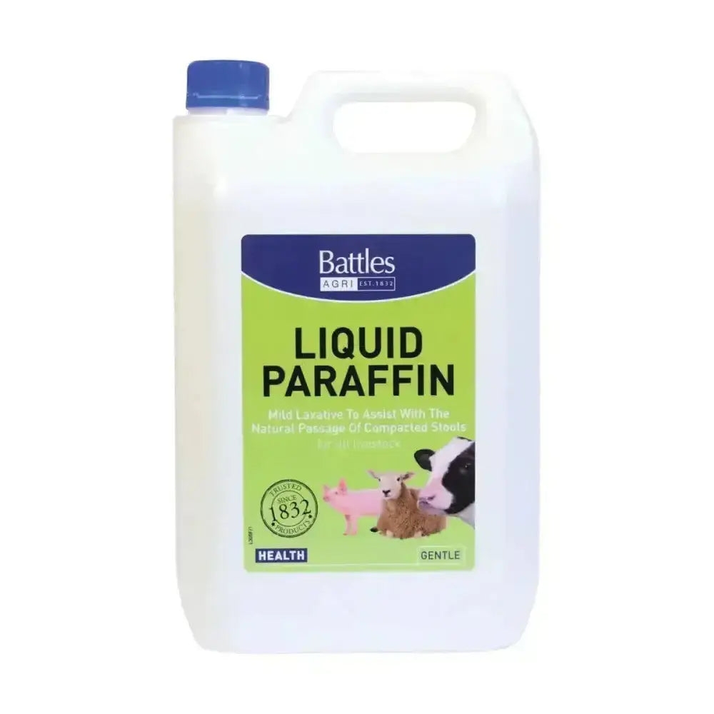White plastic jug with blue cap and green label of battles liquid paraffin for horse care use