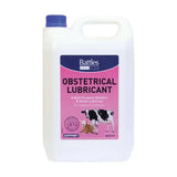 White plastic jug with blue cap and pink battles obstetrical lubricant label for livestock use