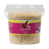 A clear plastic bucket of light beige battles poultry garlic granules natural feed additive for optimum health