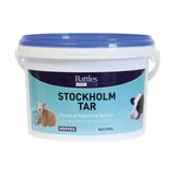 White plastic bucket with blue lid labeled battles stockholm tar for livestock hoof care featuring stockholm tar