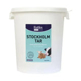 White plastic bucket of battles stockholm tar with teal navy label featuring livestock images for animal care