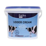 White plastic bucket with blue lid of battles udder cream featuring black and white cow label for cattle and horse care