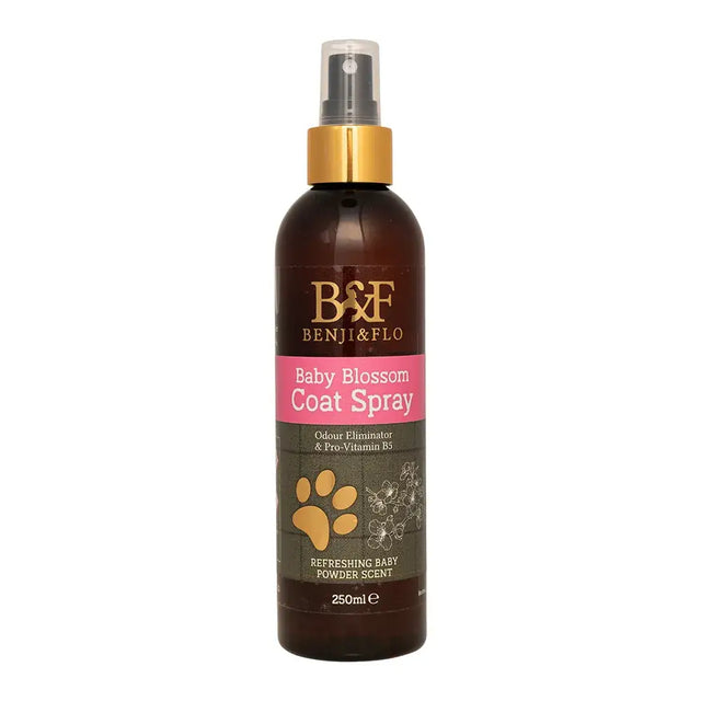 Dark brown glass bottle with gold spray nozzle and pink label of benji & flo orchard breeze coat spray