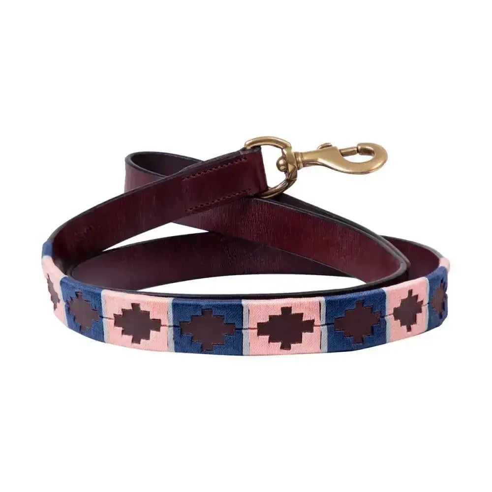 A maroon sublime polo leather dog lead by benji & flo with a blue pink geometric patterned section and brass clip