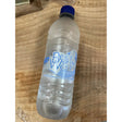 Clear plastic west bottle water with blue cap and best of the west label featuring icy mountain design