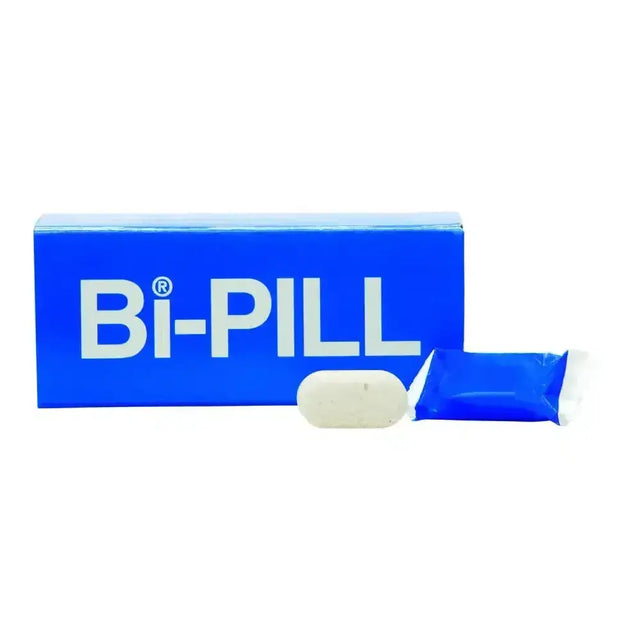 A white oval bi-pill bicarbonate pill with blue packaging and sealed foil wrapper for calves using sodium bicarbonate