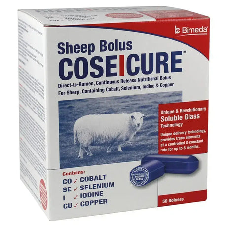 White and red bimeda coseicure sheep bolus box with blue sheep image and two dark blue glass boluses for selenium deficiencies