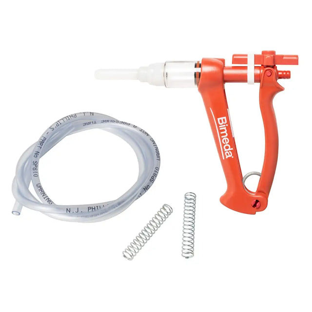 Orange plastic veterinary syringe pump with white nozzle and clear tubing in bimeda dectospot applicator