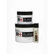 White cylindrical containers with black lids labeled bi+butter bit butter for equestrian mouth softening restores feeling