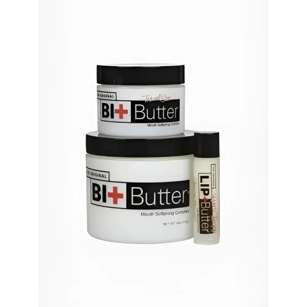 White cylindrical containers with black lids labeled bi+butter bit butter for equestrian mouth softening restores feeling