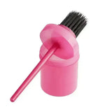 Pink plastic hoof oil brush with black bristles and matching handle from bitz hoof oil brush set