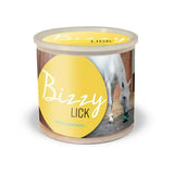 Yellow cylindrical container of bizzy lick refills with clear lid and white horse label for bizzy ball toy horse licks