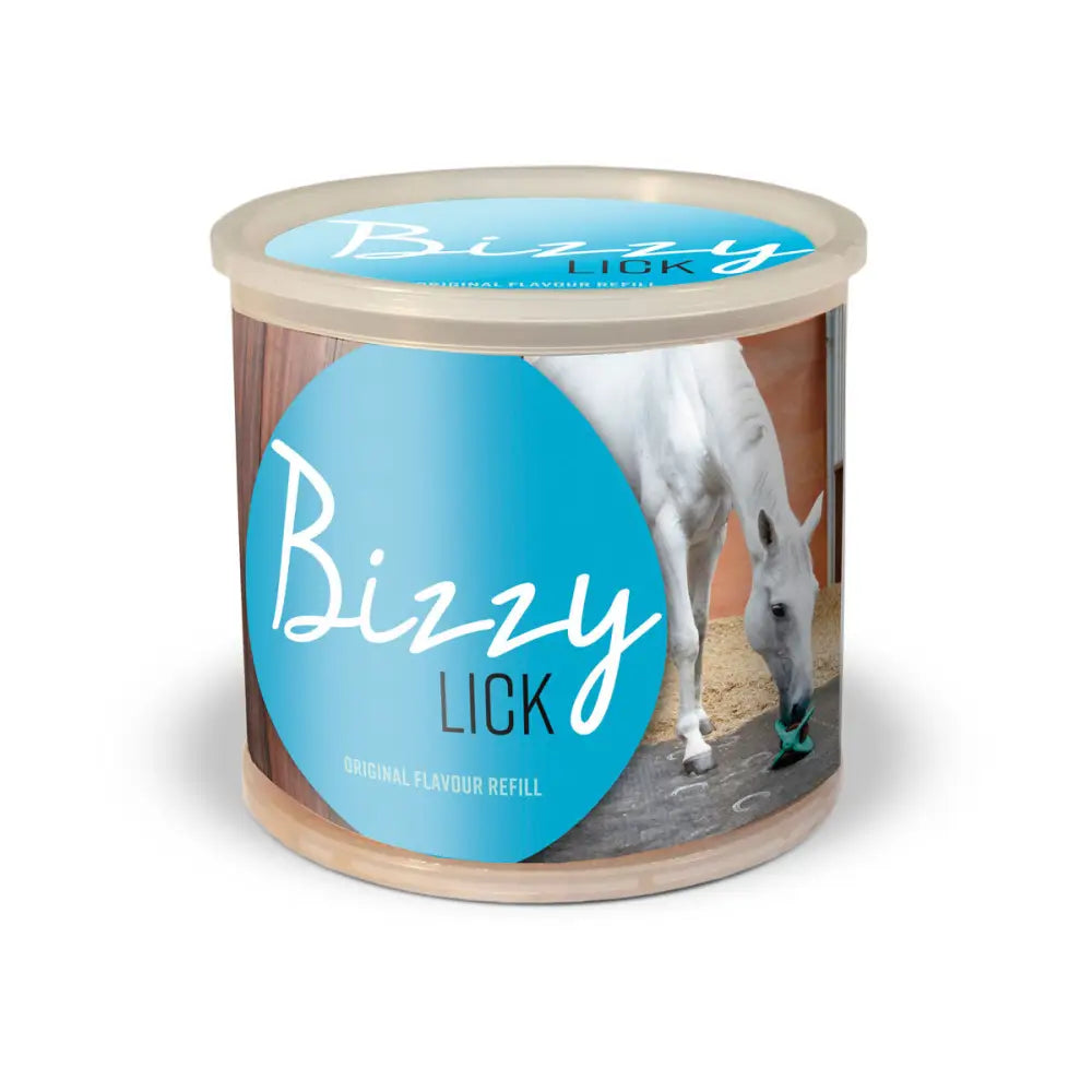A cylindrical bizzy lick refills container with a light blue label showing a white horse licking its nose for horse licks