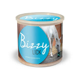 A cylindrical bizzy lick refills container with a light blue label showing a white horse licking its nose for horse licks