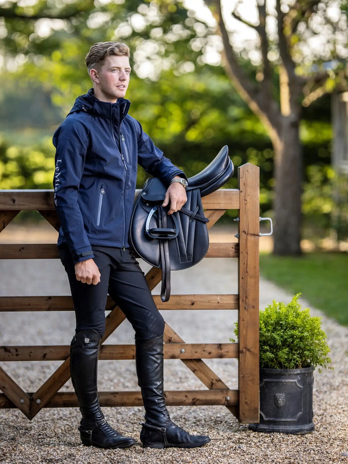 Black leather saddle with a sleek, glossy finish and classic equestrian design.