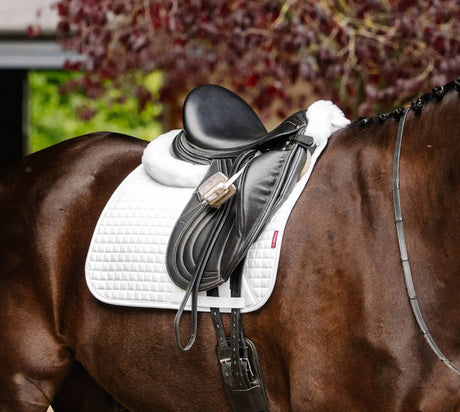 Black leather saddle with white quilted pad and plush lining.